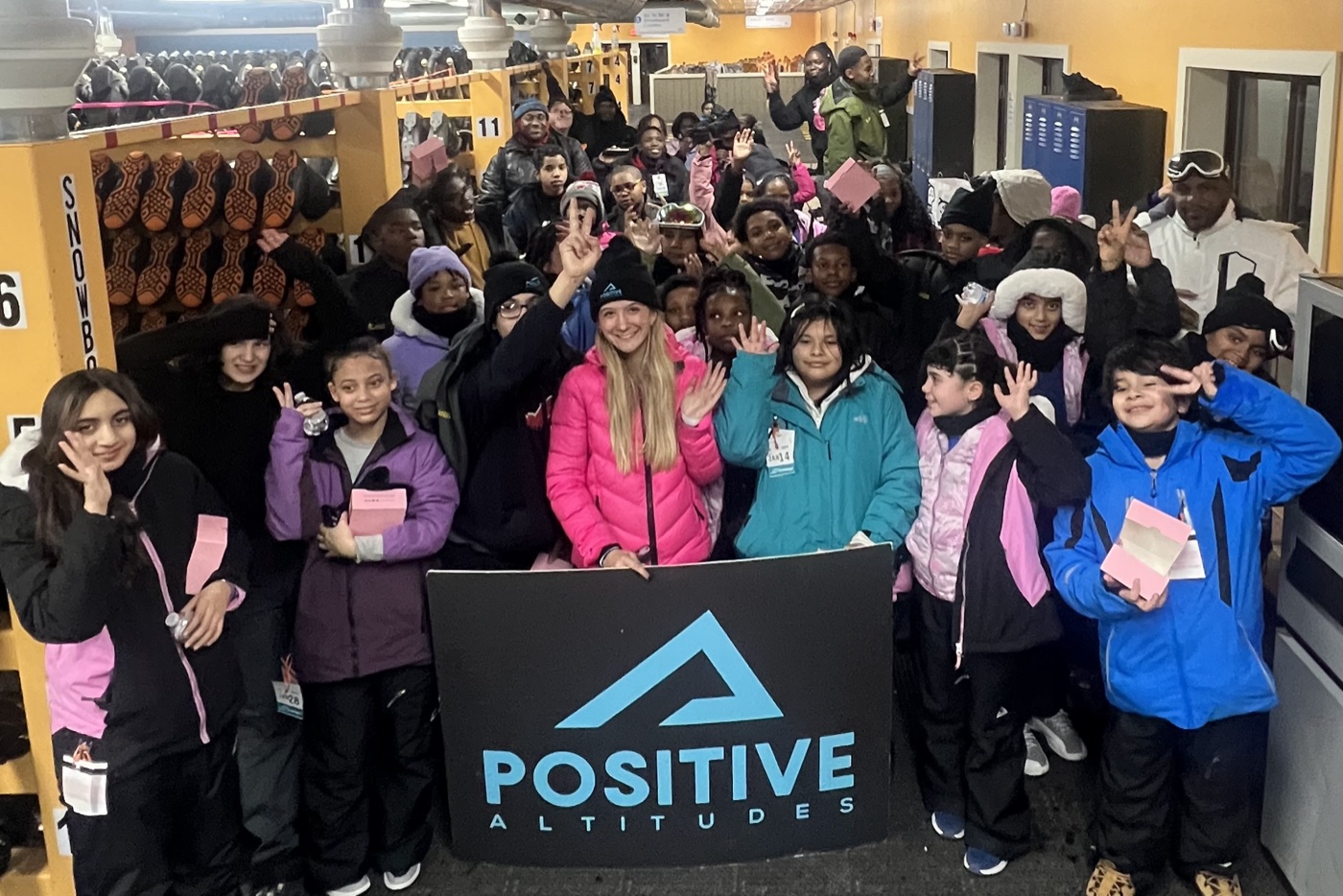The Positive Altitudes group at Sunburst holding their banner