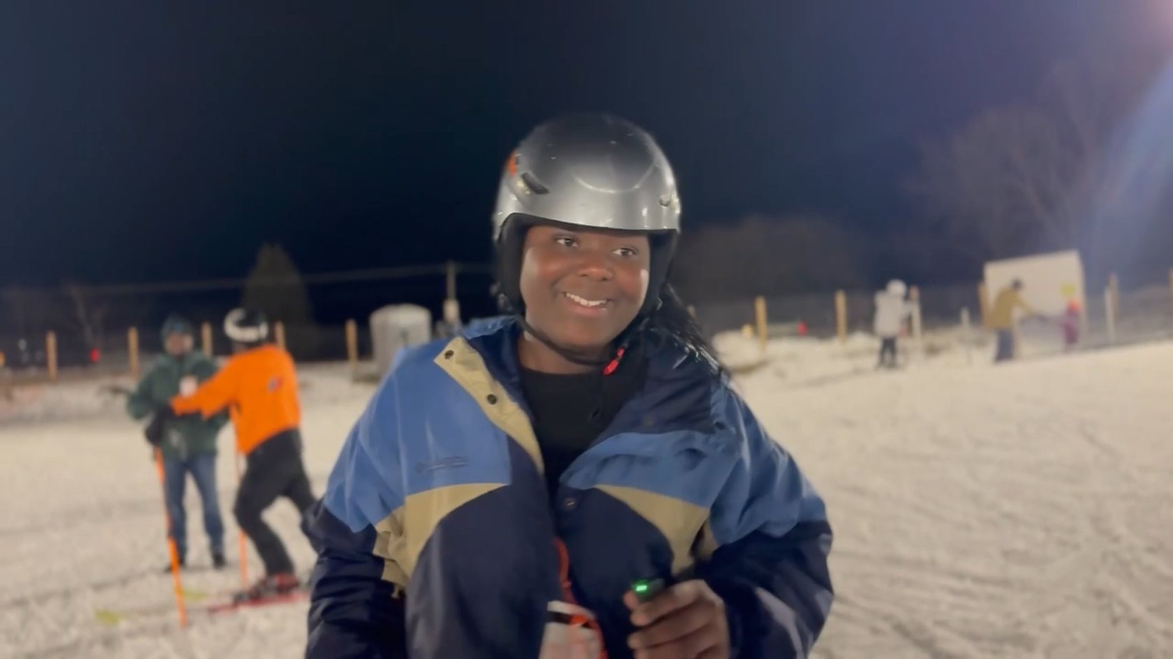 A young skier on the slopes at night with Positive Altitudes